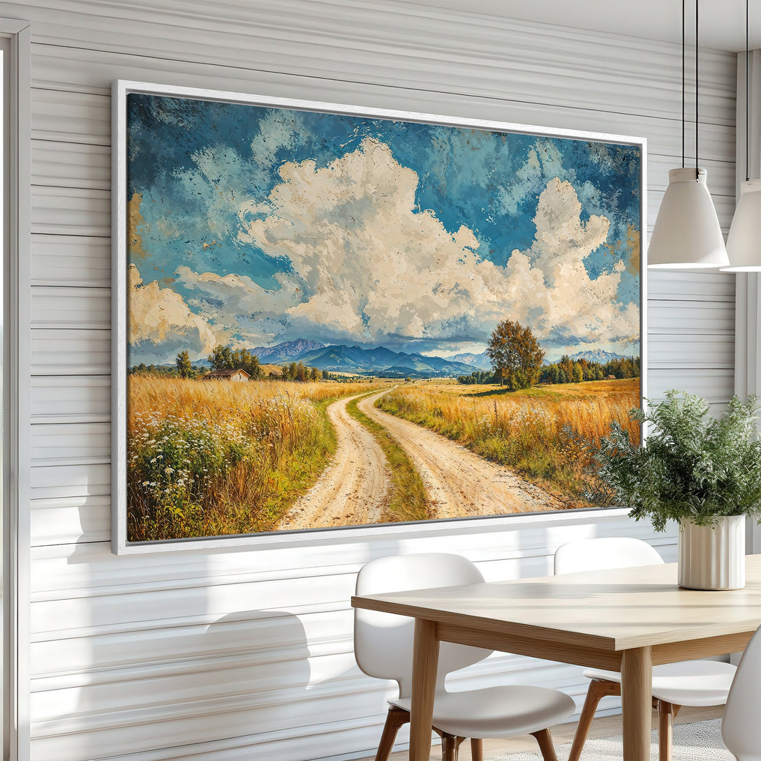 Framed Wall Art: Landscape Canvas Print featuring a winding dirt road, blue sky, & golden fields. Rustic style, warm color palette, perfect for home decor.