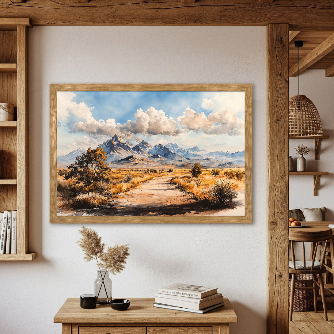 Framed Poster of a watercolor landscape painting featuring mountains, a road, and clouds. Earthy tones and blue sky. Perfect wall art.