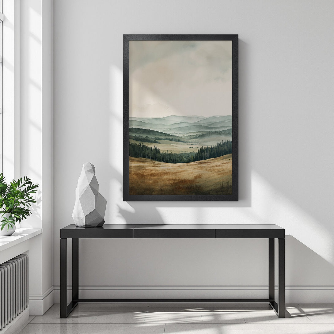 Framed Poster of a serene landscape in watercolor style, featuring mountains and fields in a muted green and brown color palette.