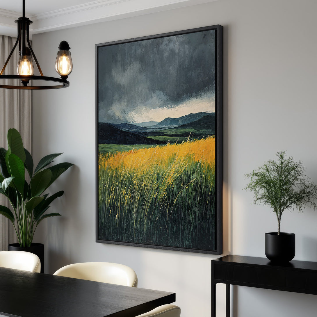 Framed Wall Art: Dramatic landscape Canvas Print with moody sky, vibrant yellow field, and dark green mountains. Modern art for your home, featuring a calming color palette.