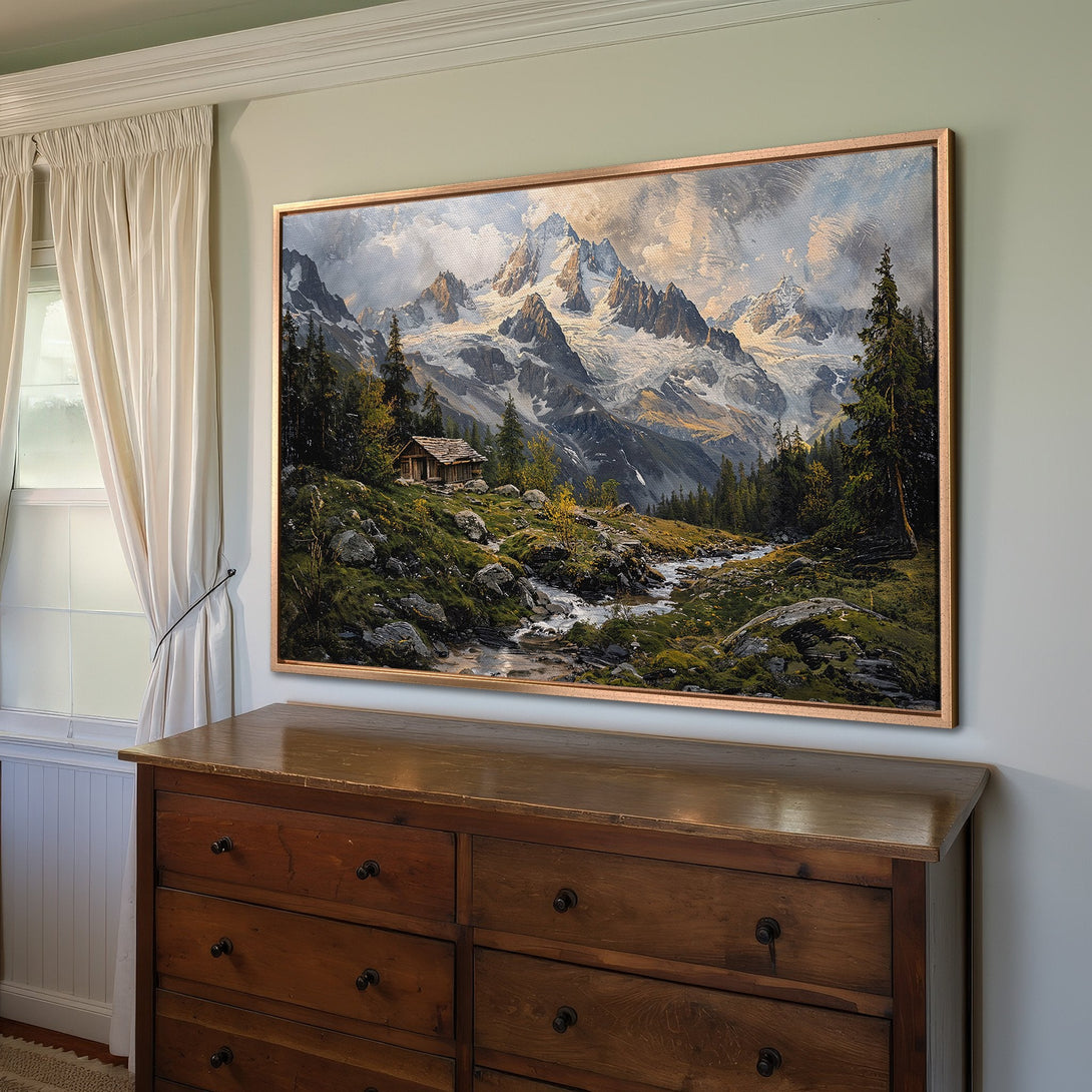Framed Wall Art: Majestic mountain landscape Canvas Print, featuring a rustic cabin, lush greenery, and a cool, earthy color palette. Perfect for any home!