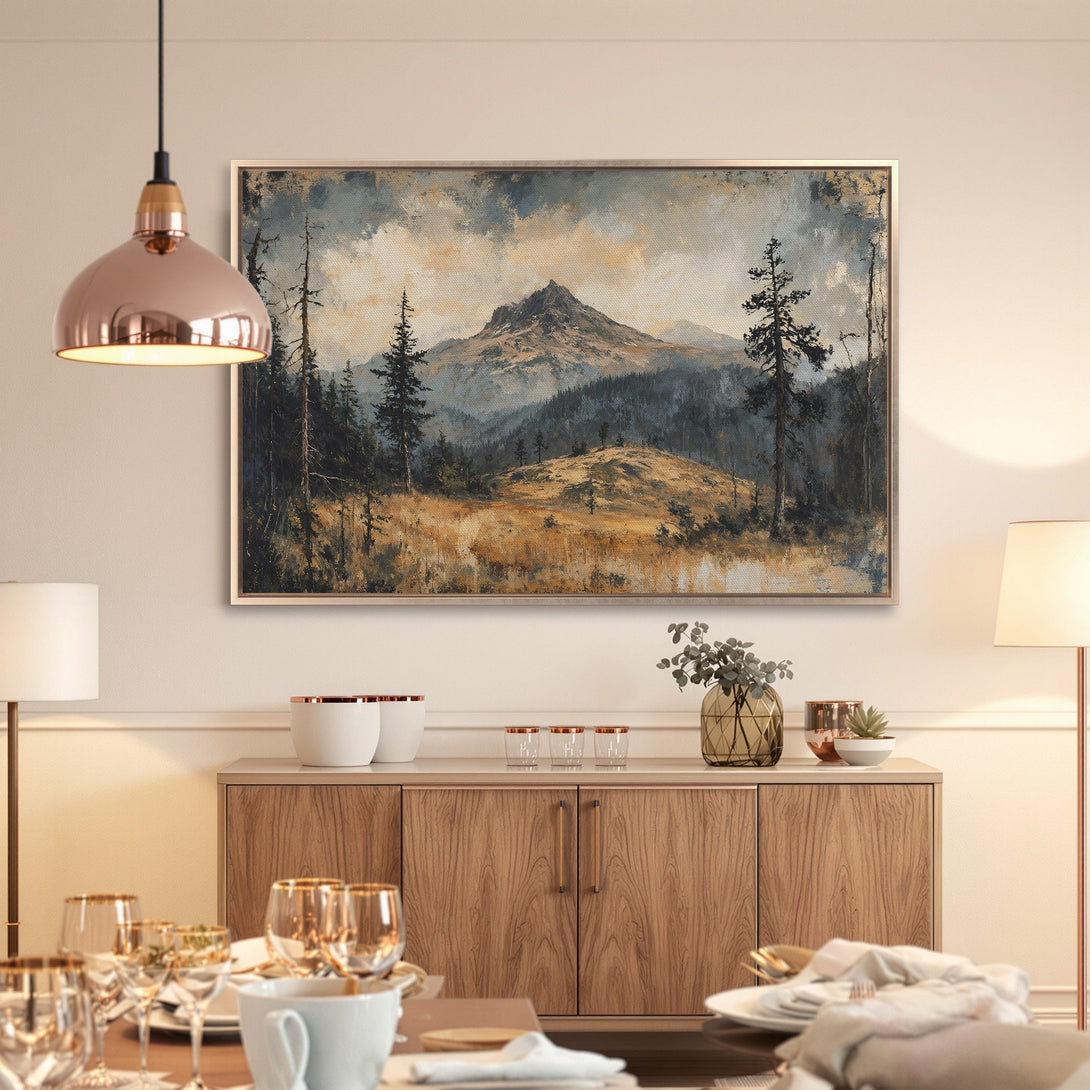 Framed Wall Art: Mountain landscape canvas print in muted blues and golds. Rustic style art perfect for a cozy dining room.