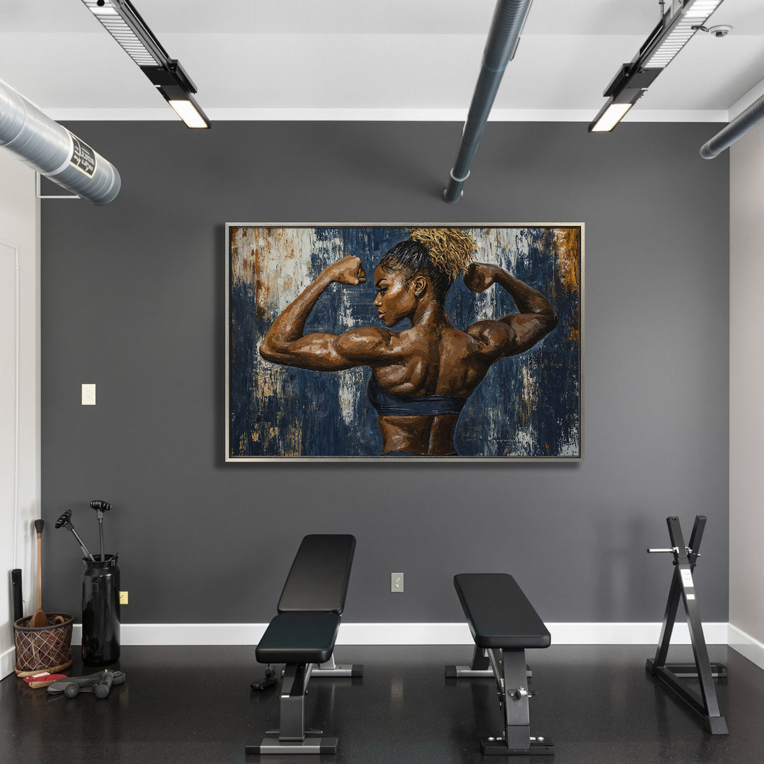Framed Wall Art of a muscular woman flexing, displayed in a gym. Abstract style with a blue, brown, and gold color palette. Perfect for home decor.