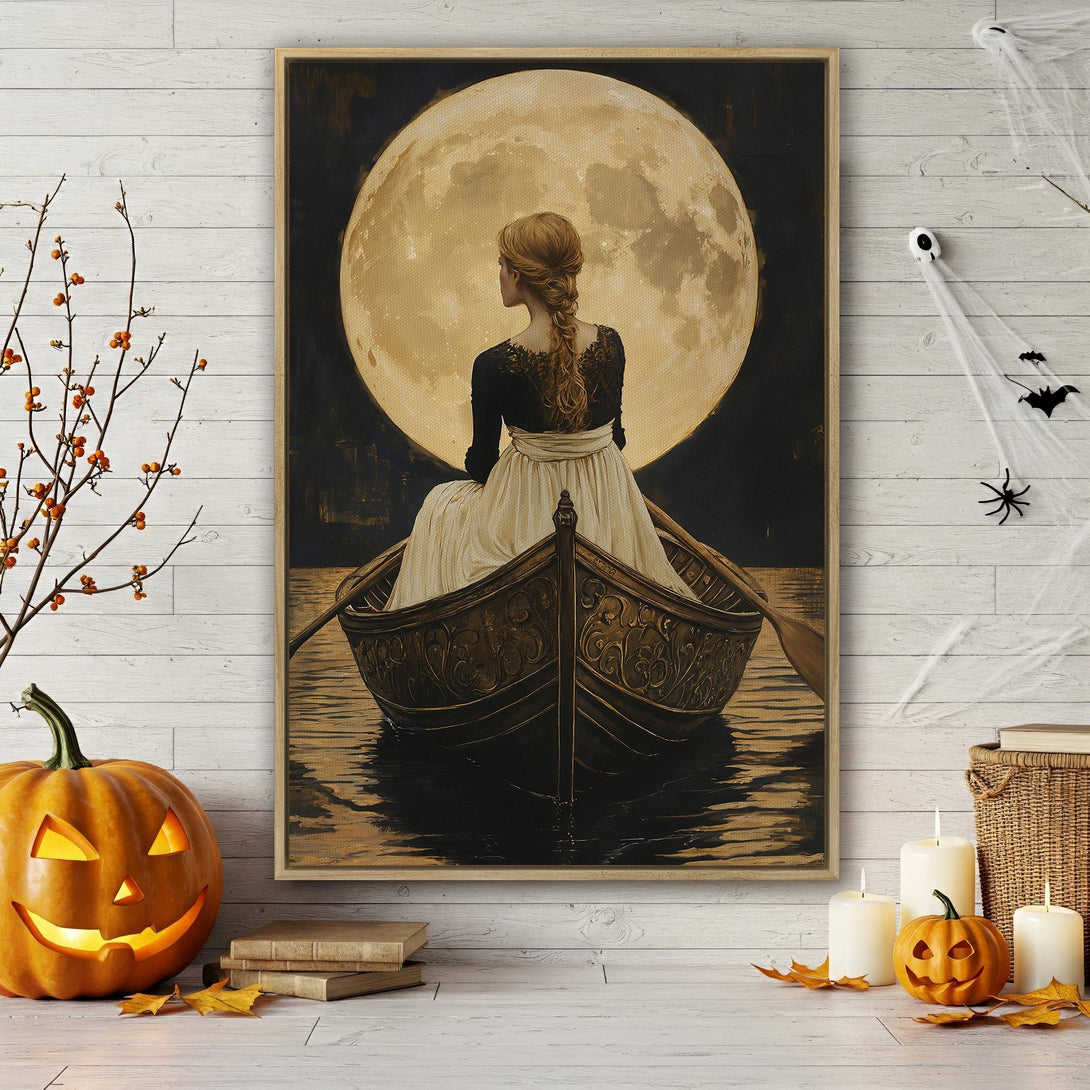 Framed Wall Art featuring a woman in a boat under a full moon. Vintage style, warm gold and black color palette. Perfect for Halloween decor.