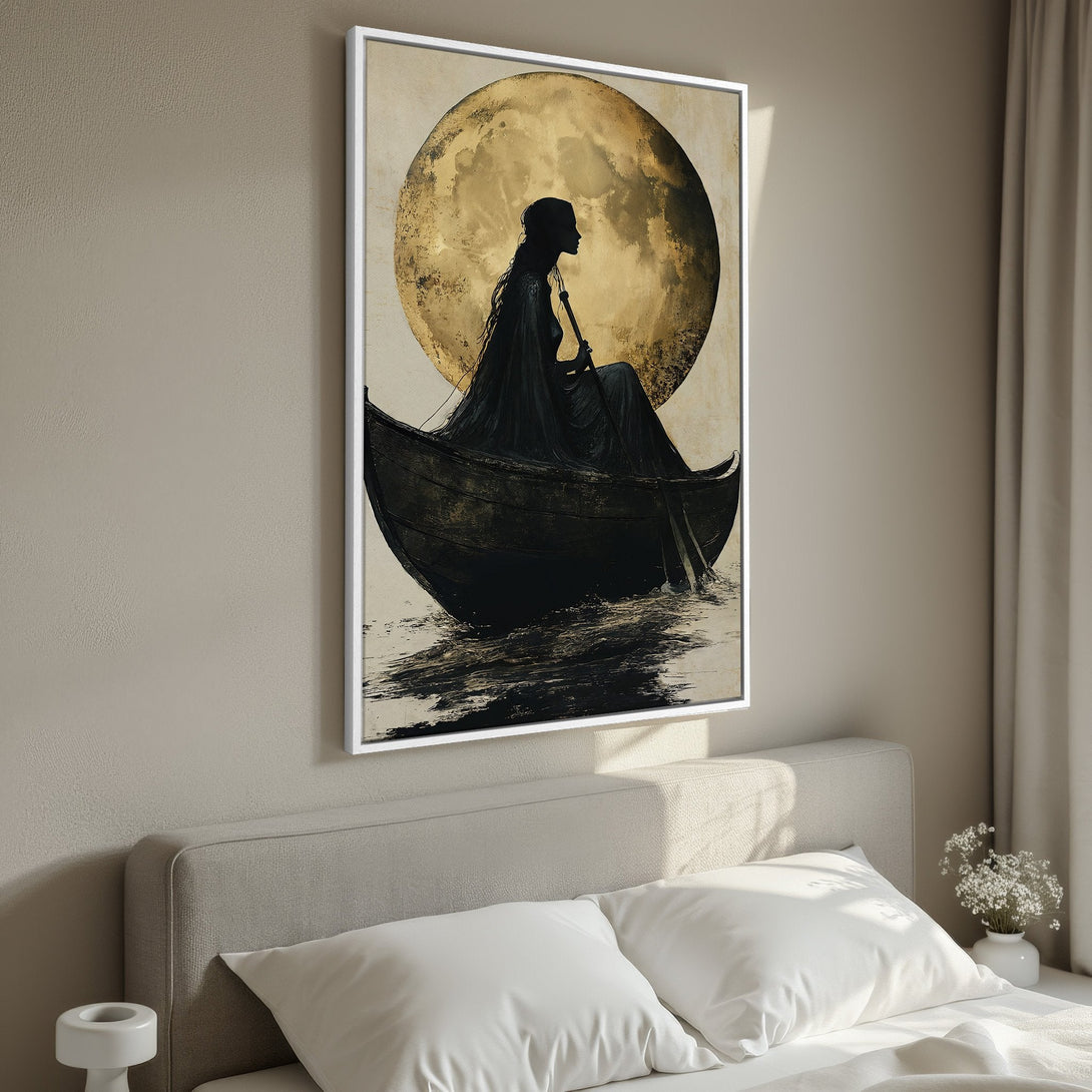 Framed Wall Art: Silhouette in boat under golden moon. Moody, artistic canvas print with black, gold, and neutral tones. Perfect for bedroom decor.