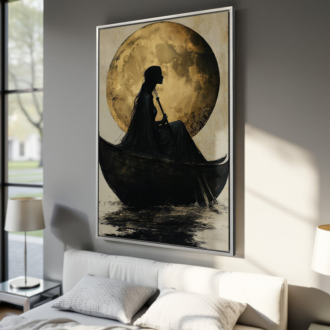 Framed Wall Art: Silhouette in a boat against a golden moon. Dramatic, artistic style with a black, gold, and neutral color palette. Perfect for bedroom decor.