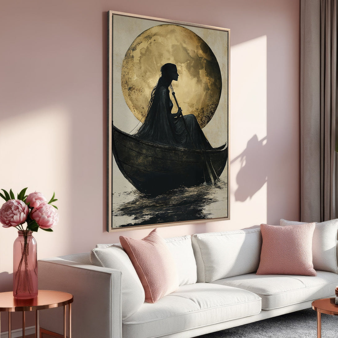 Framed Wall Art: Silhouette of woman in boat with moon, modern art in black, gold, and blush pink. Perfect for living room decor.