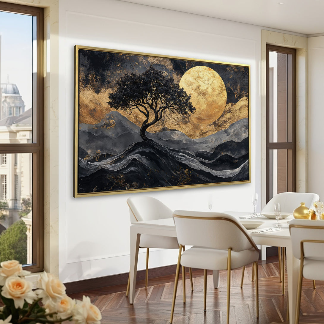 Canvas Print of a tree silhouetted against a golden moon. Modern abstract art in a moody black, gold, and gray color palette. Perfect for home decor.