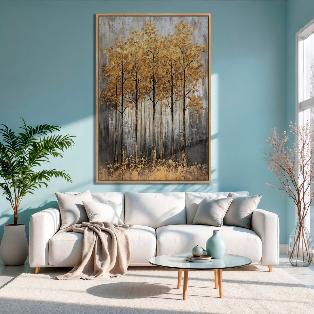 Framed Wall Art: Abstract golden trees canvas print in a modern living room. Earthy tones and blue accent wall create a calming, stylish space.