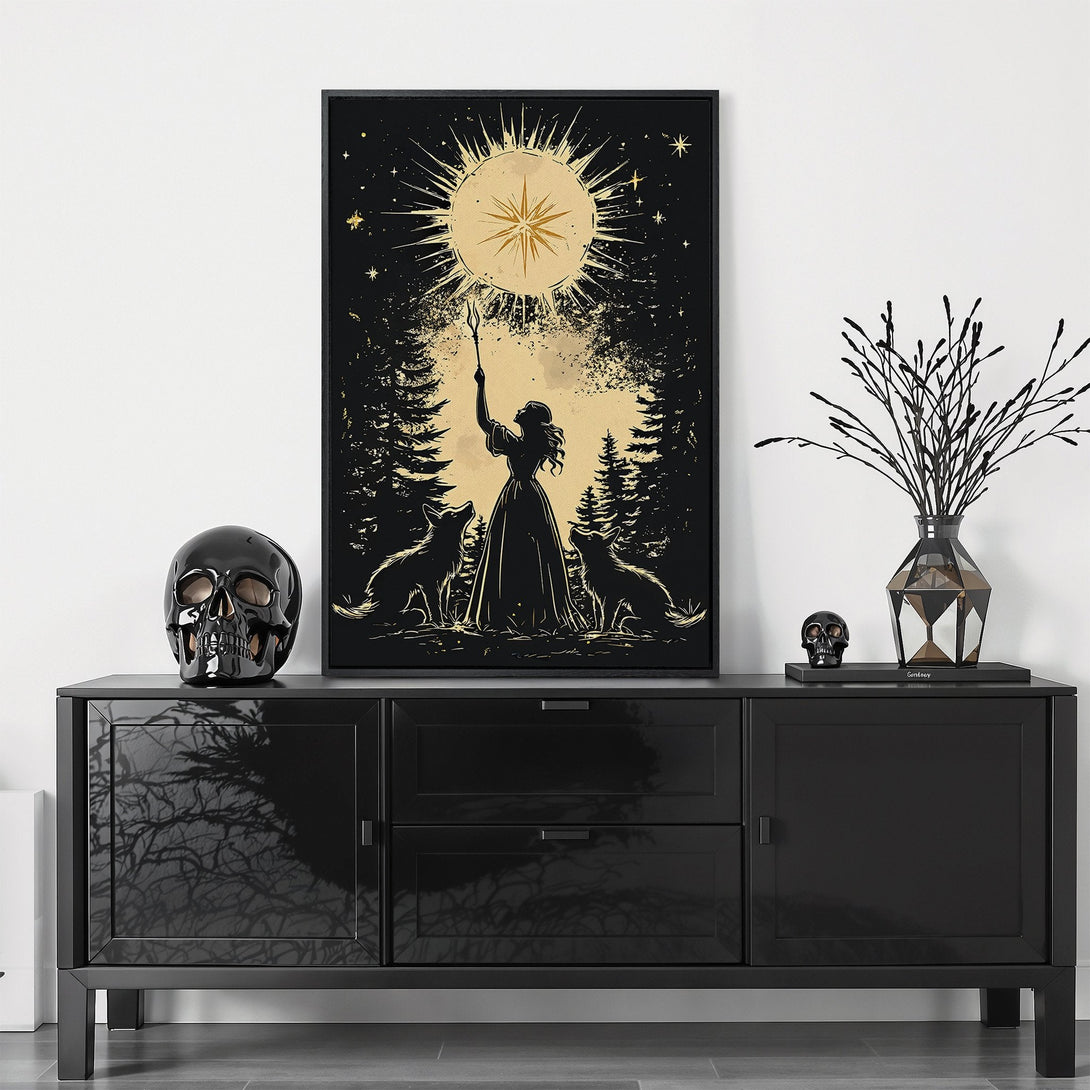 Framed Wall Art featuring a mystical woman with wolves, set in a forest. Artistic style with a black, gold, and beige color palette. Perfect for adding a touch of magic.