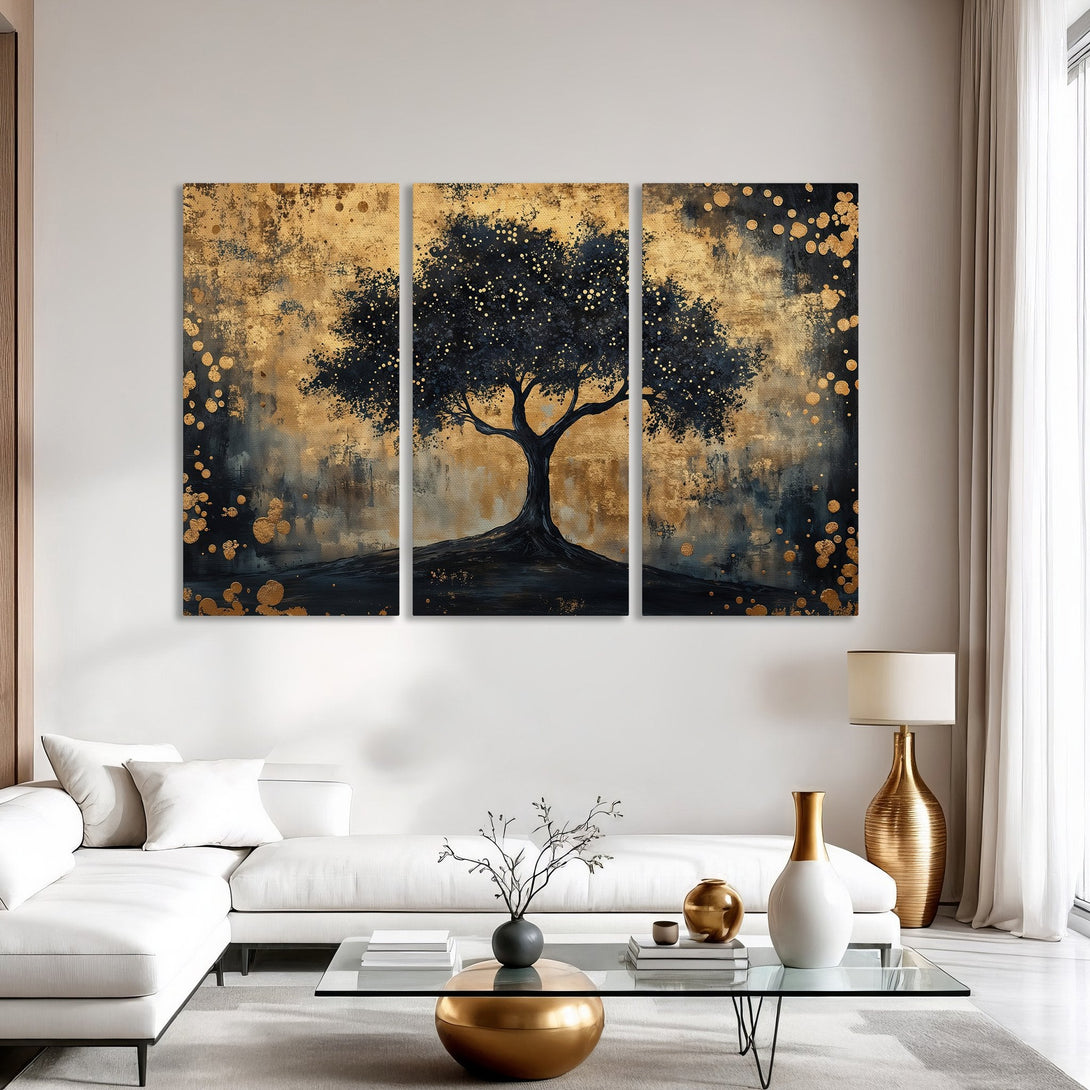 Abstract Canvas Print of a tree in gold and navy blue, displayed in a modern living room. Adds a touch of elegance.