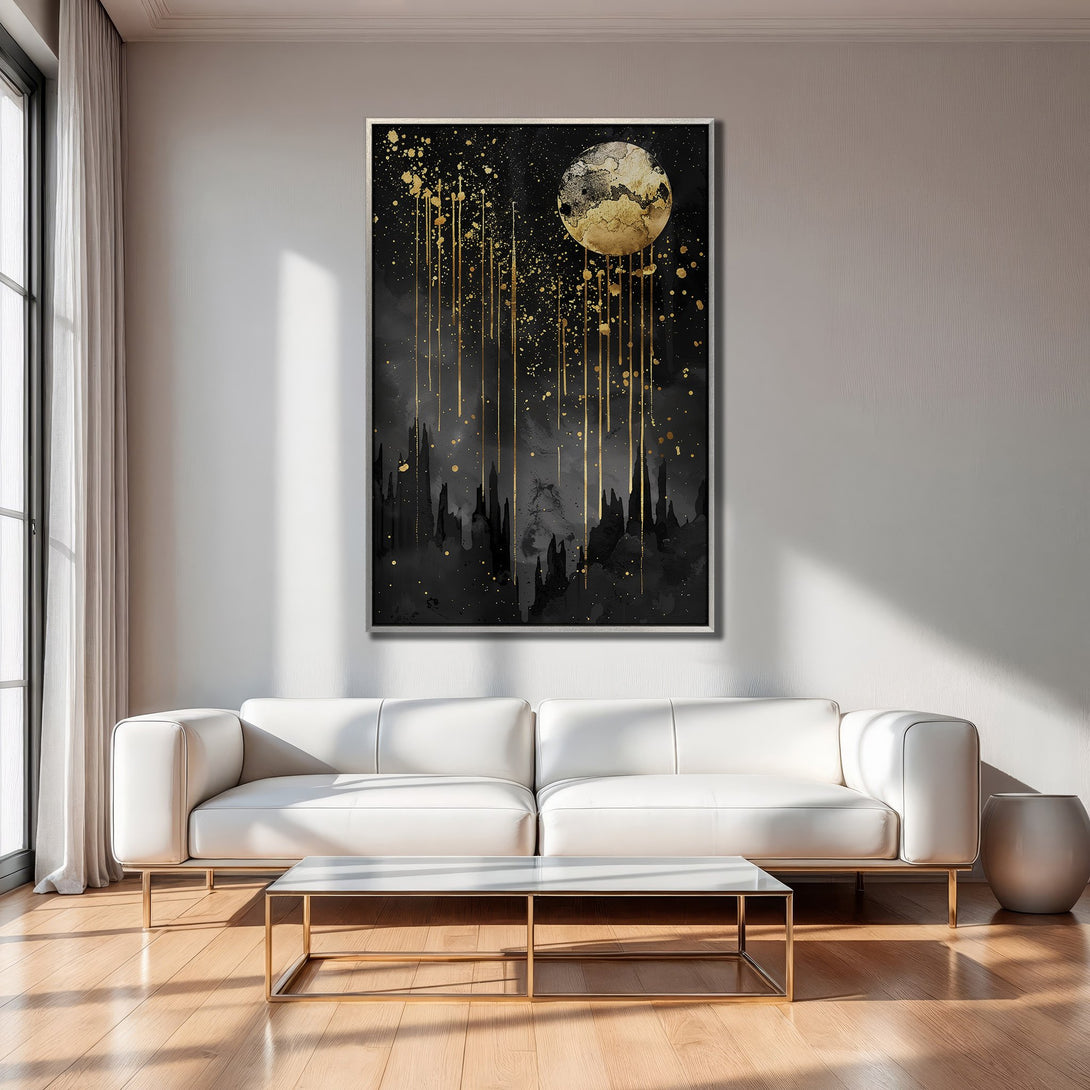 Framed Wall Art: Abstract moon and gold splatter art on black background. Modern decor in a living room with a white sofa.