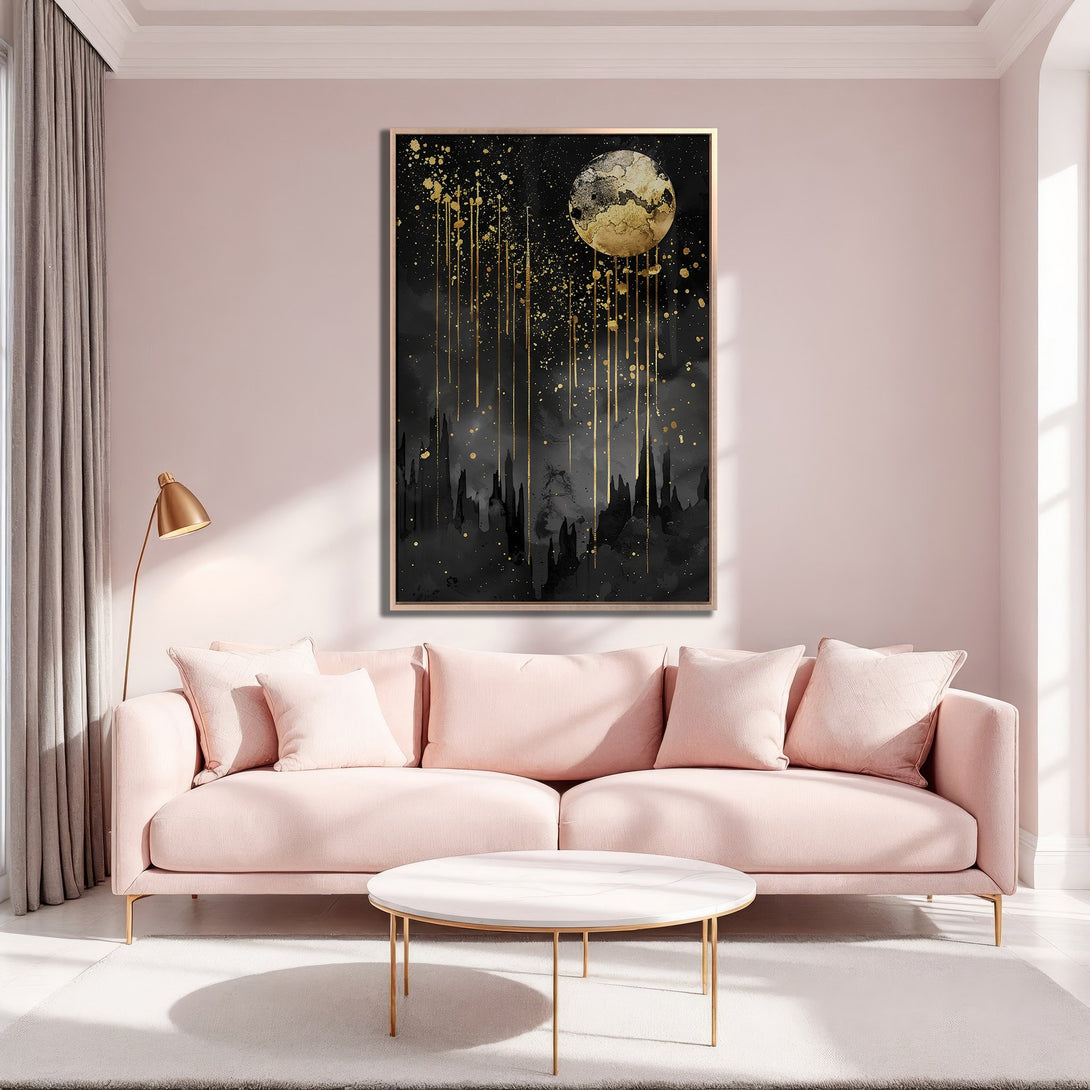 Framed Wall Art featuring a celestial abstract design in black and gold. Modern canvas print adds elegance to a blush pink interior.
