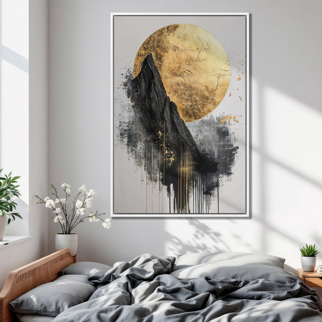 Framed Wall Art: Abstract mountain and gold moon art print in a bedroom. Modern style with black, gold, and gray color palette. Enhance your space today!