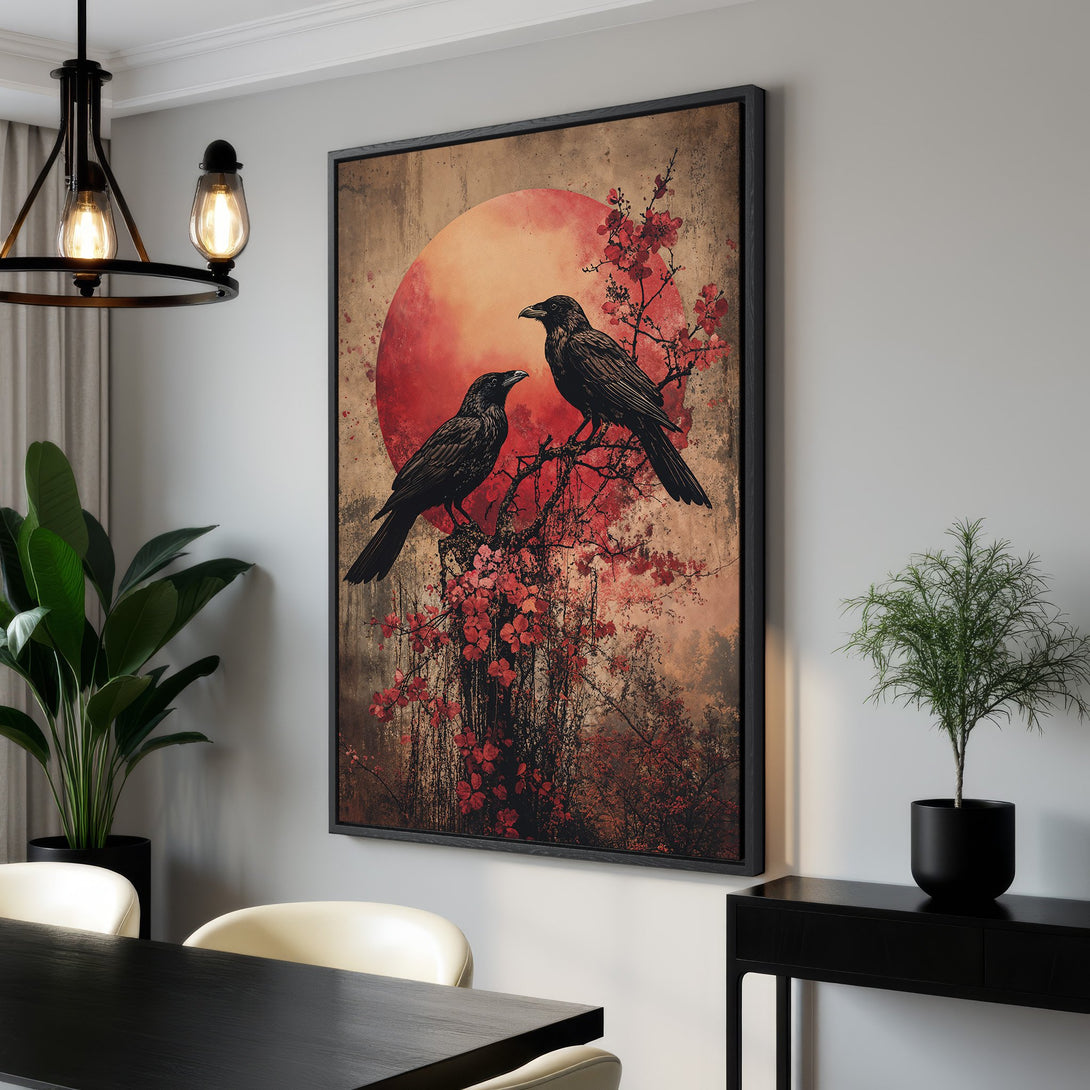 Framed Wall Art: Two ravens perched on a branch against a red sun, in a vintage style. Earthy tones with pops of red. Perfect for any room!