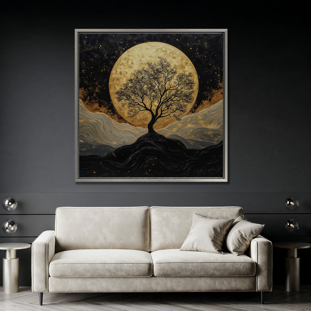 Framed Wall Art featuring a tree silhouette against a golden moon. Modern, abstract style with a black, gold, and gray color palette. Perfect for home decor.