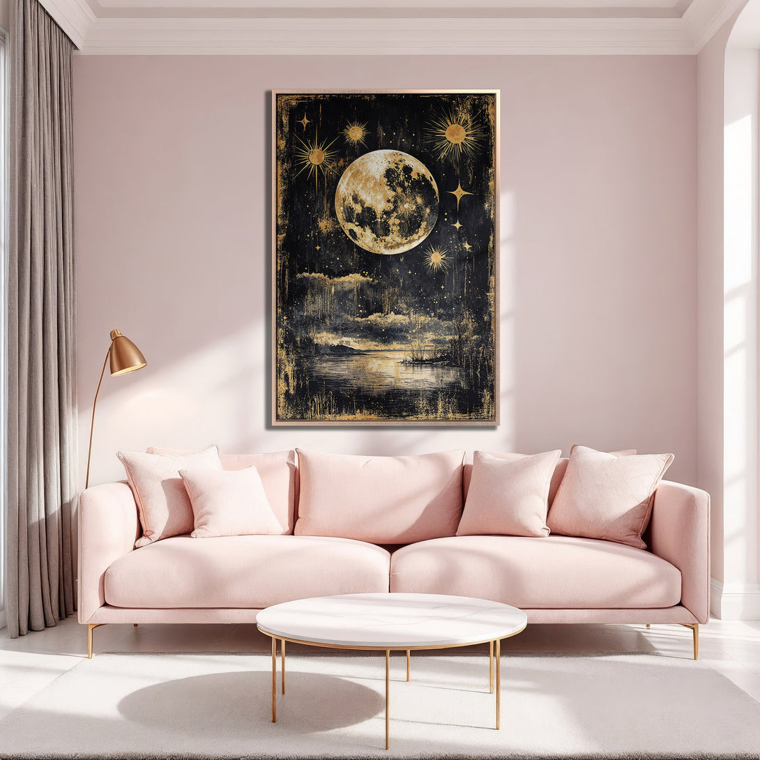 Framed Wall Art featuring a celestial moon and stars in gold and black against a blush pink interior. Modern, artistic canvas print for home decor.