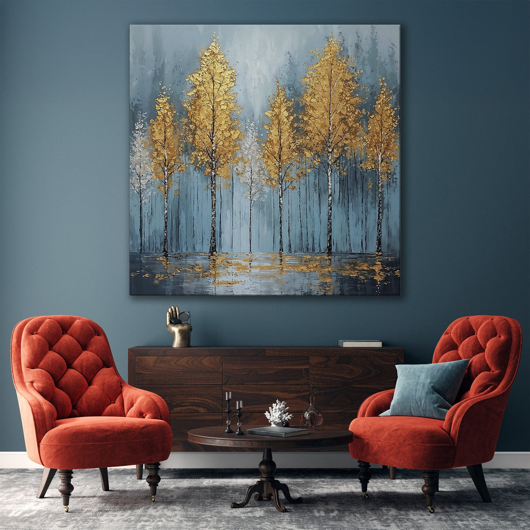 Framed Wall Art featuring gold trees in a serene forest scene. Blue and gold color palette adds elegance to any space. Perfect for living rooms!