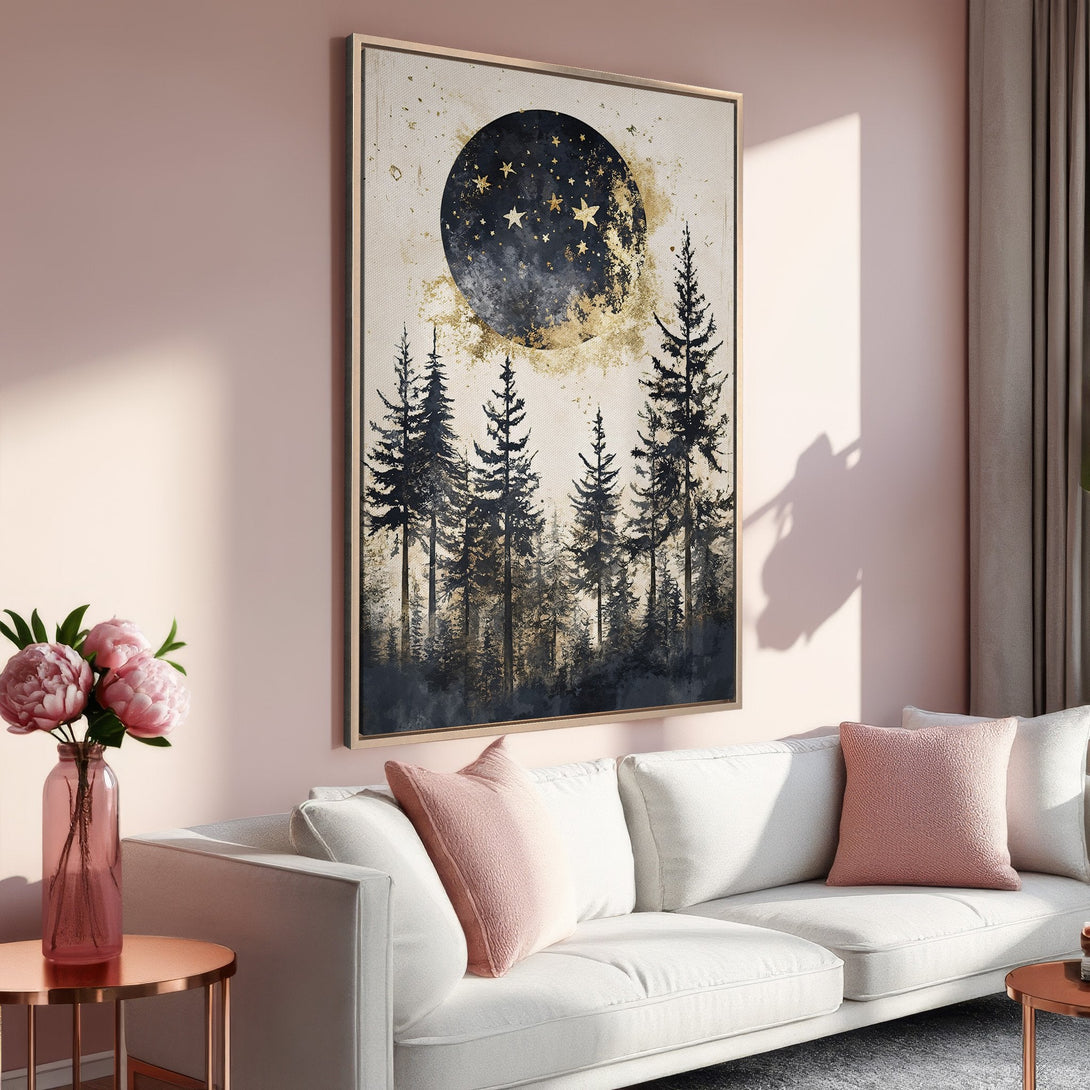 Framed Wall Art: Forest moon scene in black, gold, and cream. Modern canvas print adds a touch of elegance to any space. Soft pink interior.