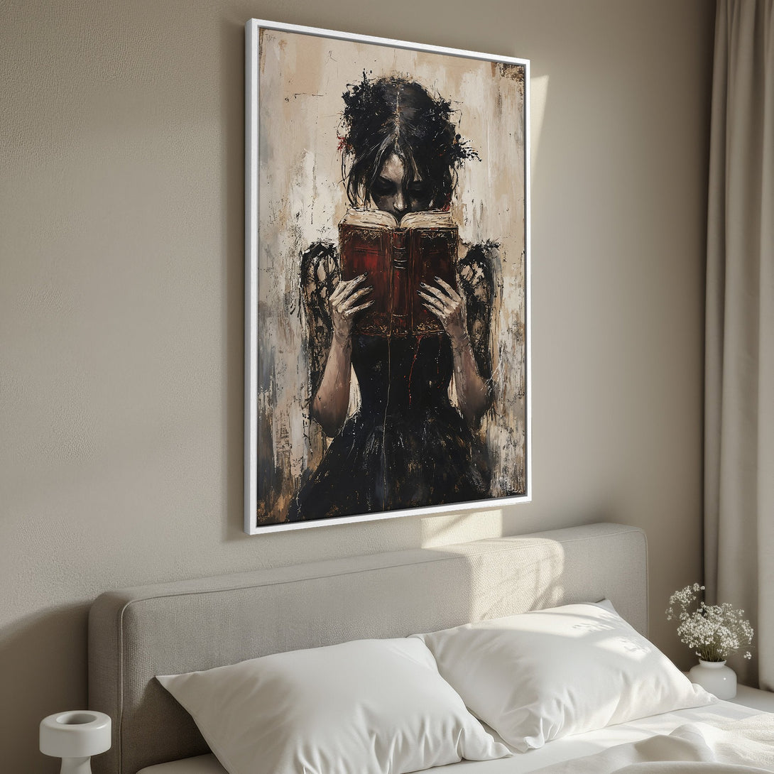 Framed Wall Art featuring a gothic woman reading a book, in a dark and moody style with a neutral color palette. Perfect for adding a touch of mystery.
