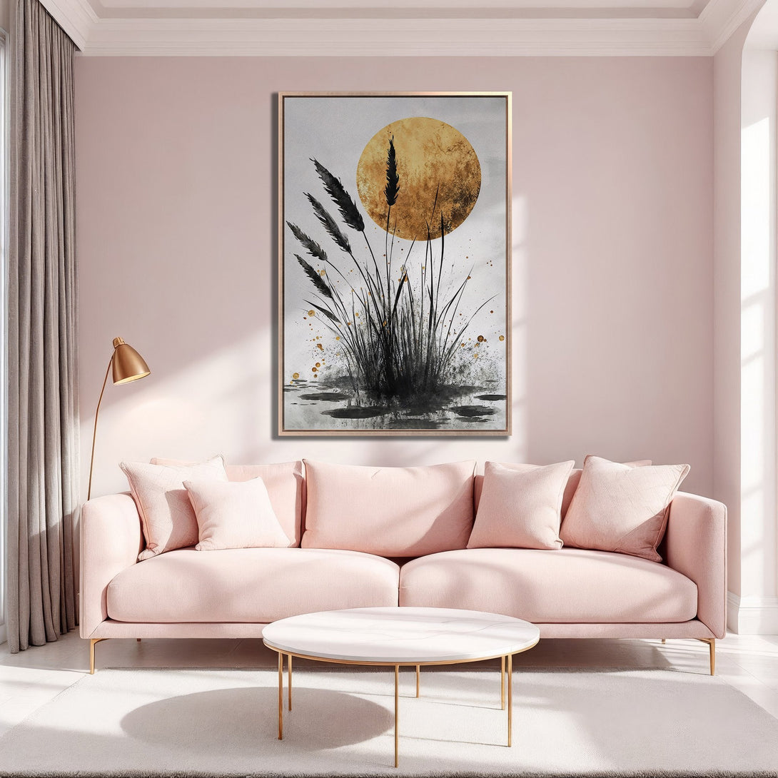 Framed Wall Art featuring abstract black and gold reeds against a golden sun, displayed in a pink living room. Modern art to elevate your space.