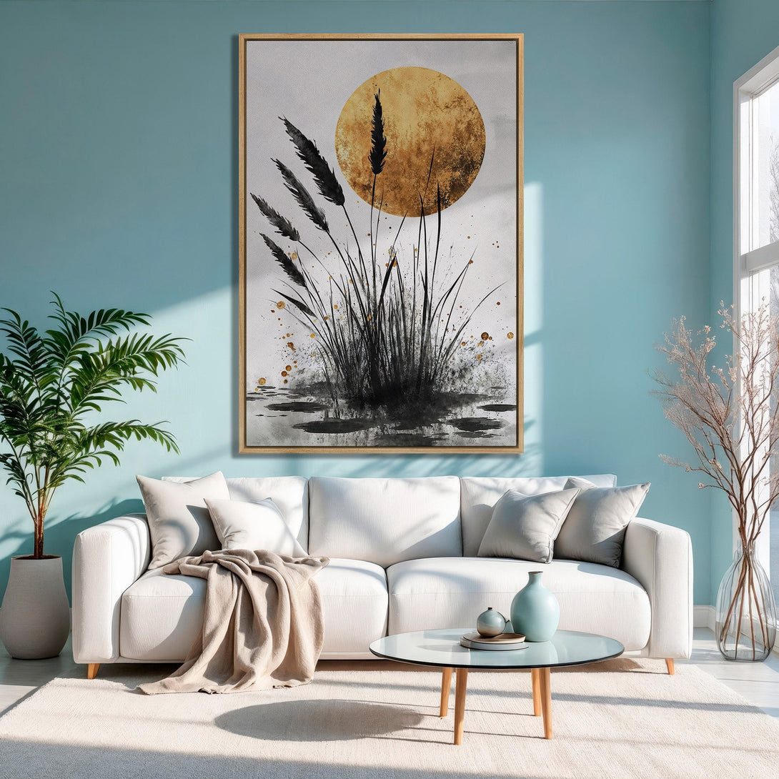 Framed Wall Art: Abstract black and gold botanical print in a modern living room. Earthy tones complement the serene blue wall. Perfect home decor!