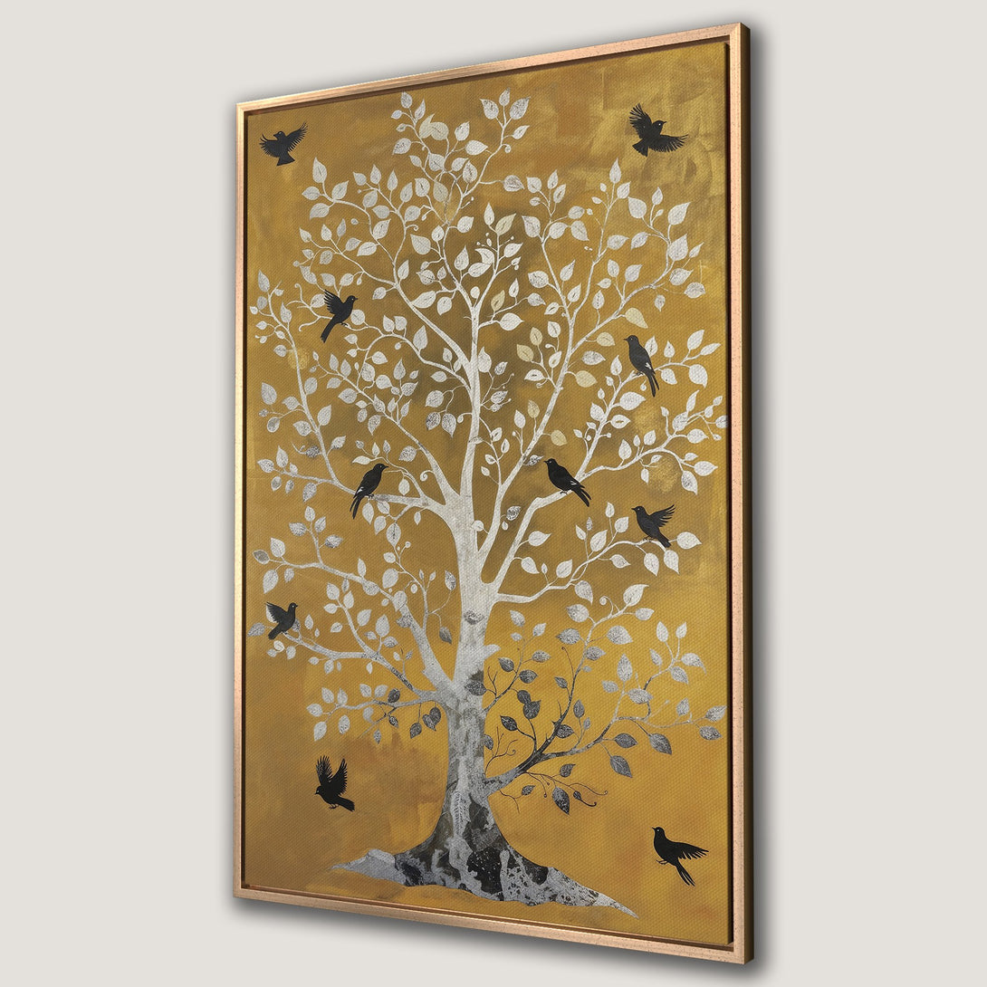 Framed Wall Art featuring a stylized tree with birds, in a gold, silver, and black color palette. Perfect for adding a touch of elegance to any space.
