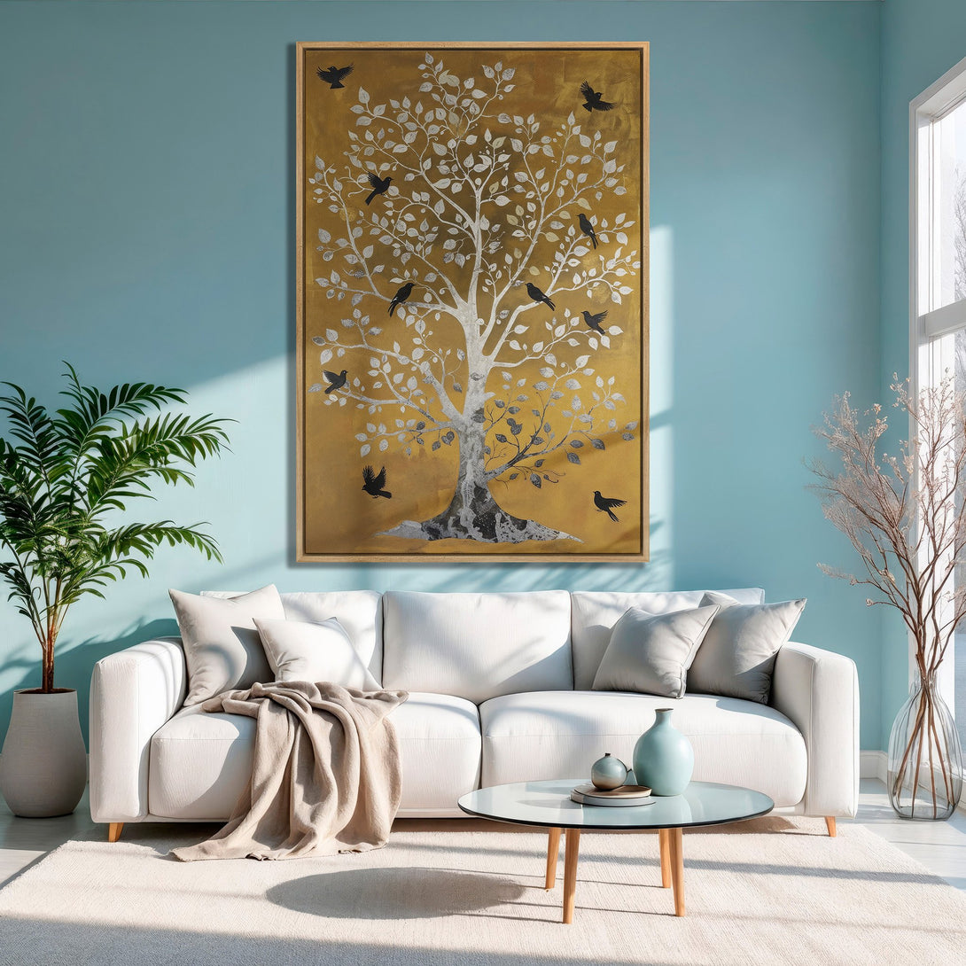 Framed Wall Art: Gold & silver tree with birds on a mustard background. Modern art in a serene living room with a cool blue and neutral color palette.