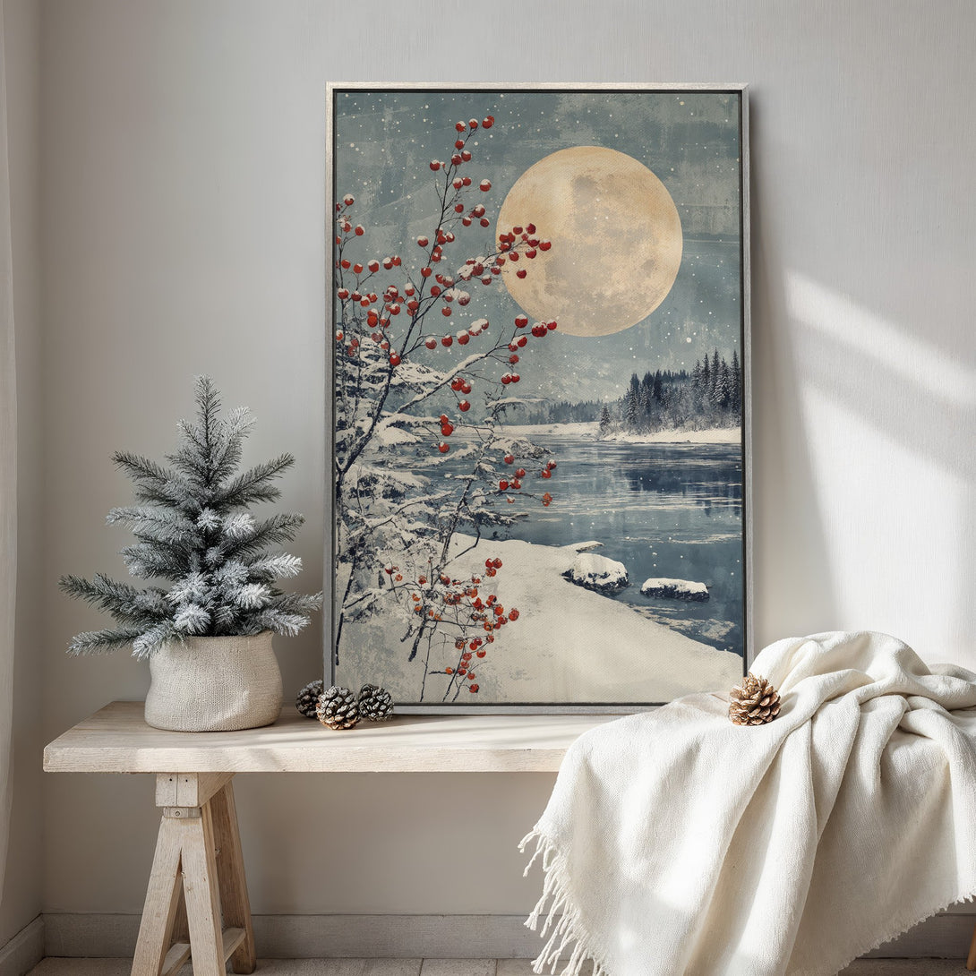Framed Wall Art: Winter landscape Canvas Print with a full moon, snow, and red berries. Blue, white, and warm tones create a cozy, artistic aesthetic.