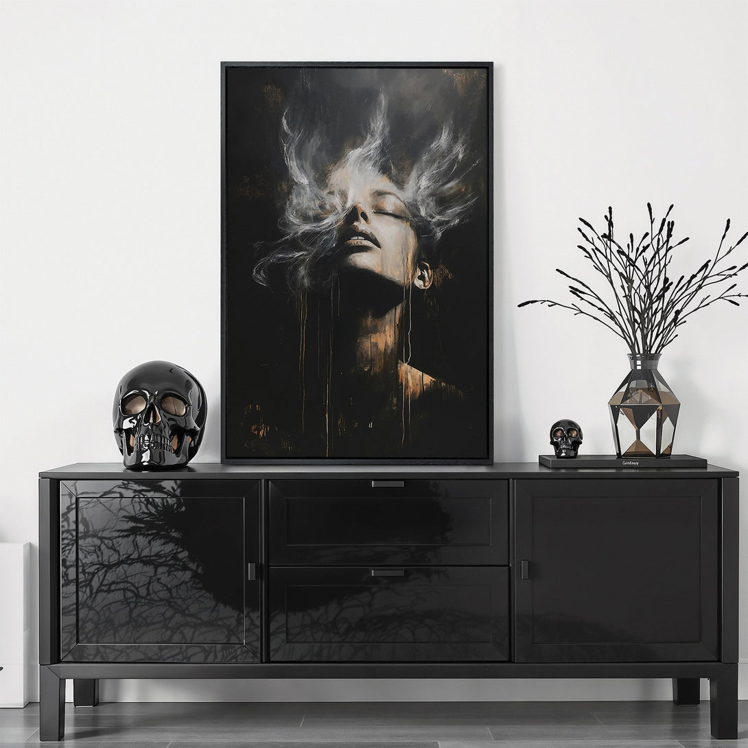 Framed Wall Art featuring a woman's face in a dramatic, abstract style. Dark, moody color palette with gold accents. Elevate your space with this stunning art piece.