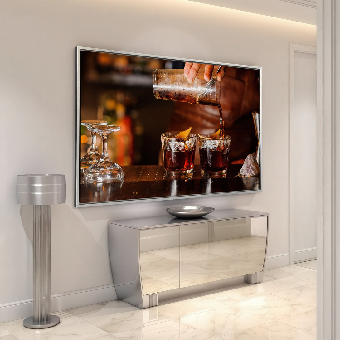 Framed Wall Art: Cocktail pouring scene in warm tones, perfect for adding a touch of sophistication to your home bar or living space.