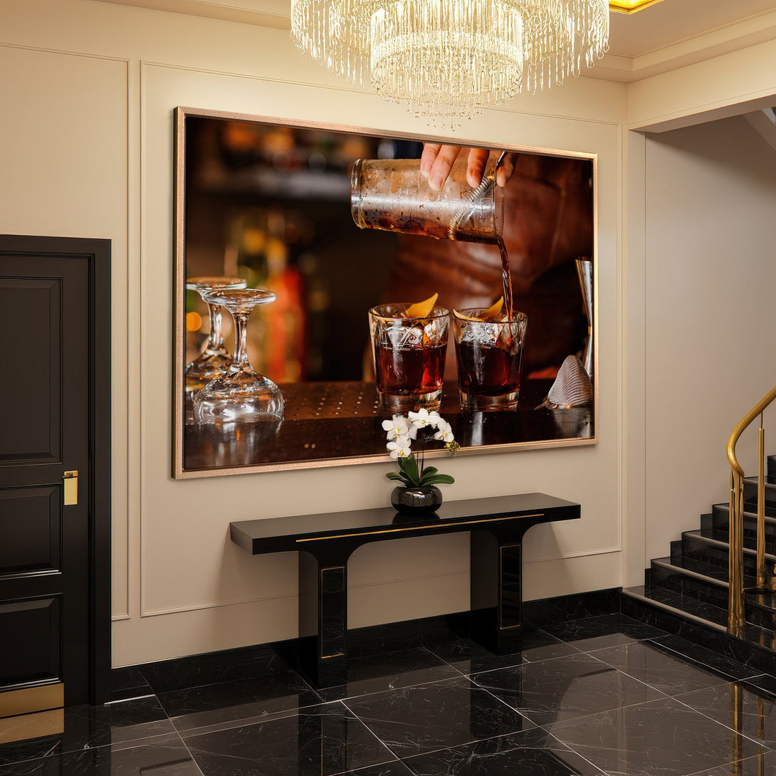 Framed Wall Art: Cocktail pouring scene in a luxury interior. Warm, inviting colors with a sophisticated, modern style. Perfect for home decor.
