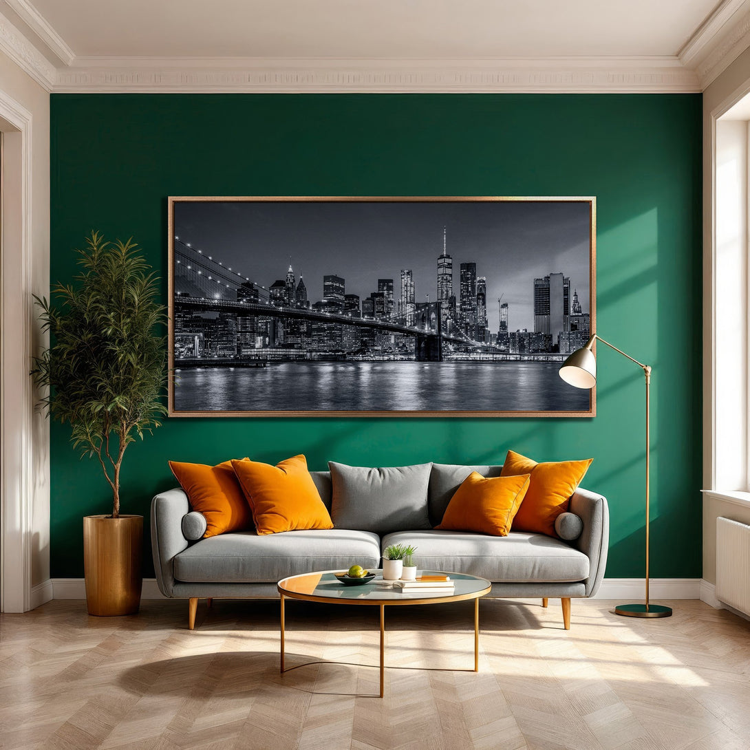 Framed Wall Art of NYC skyline in black and white, displayed in a modern living room with emerald green walls and orange accents.