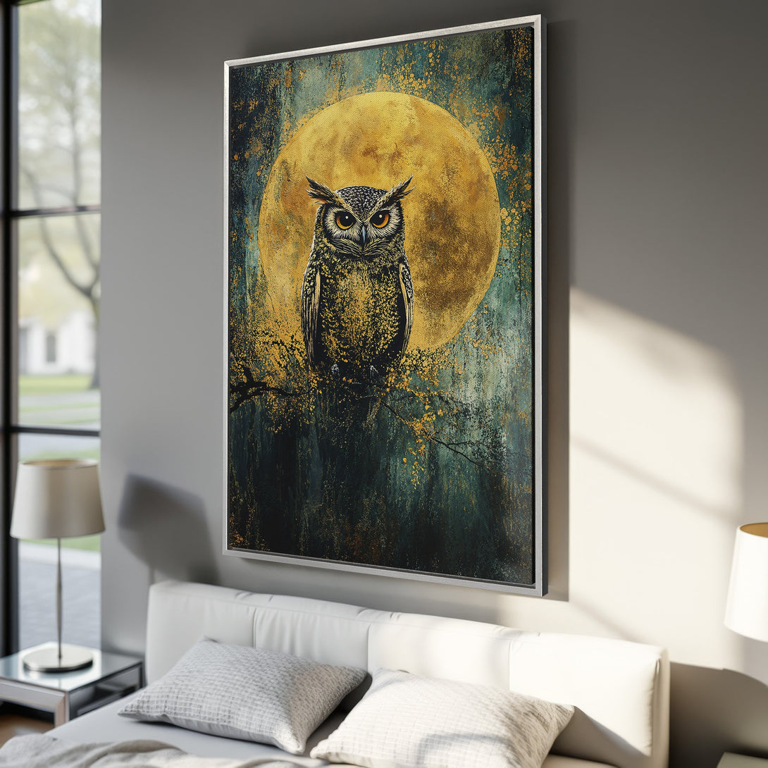 Framed Wall Art featuring an owl against a golden moon. Dramatic, artistic style with a teal and gold color palette. Perfect for adding a touch of nature to your decor.
