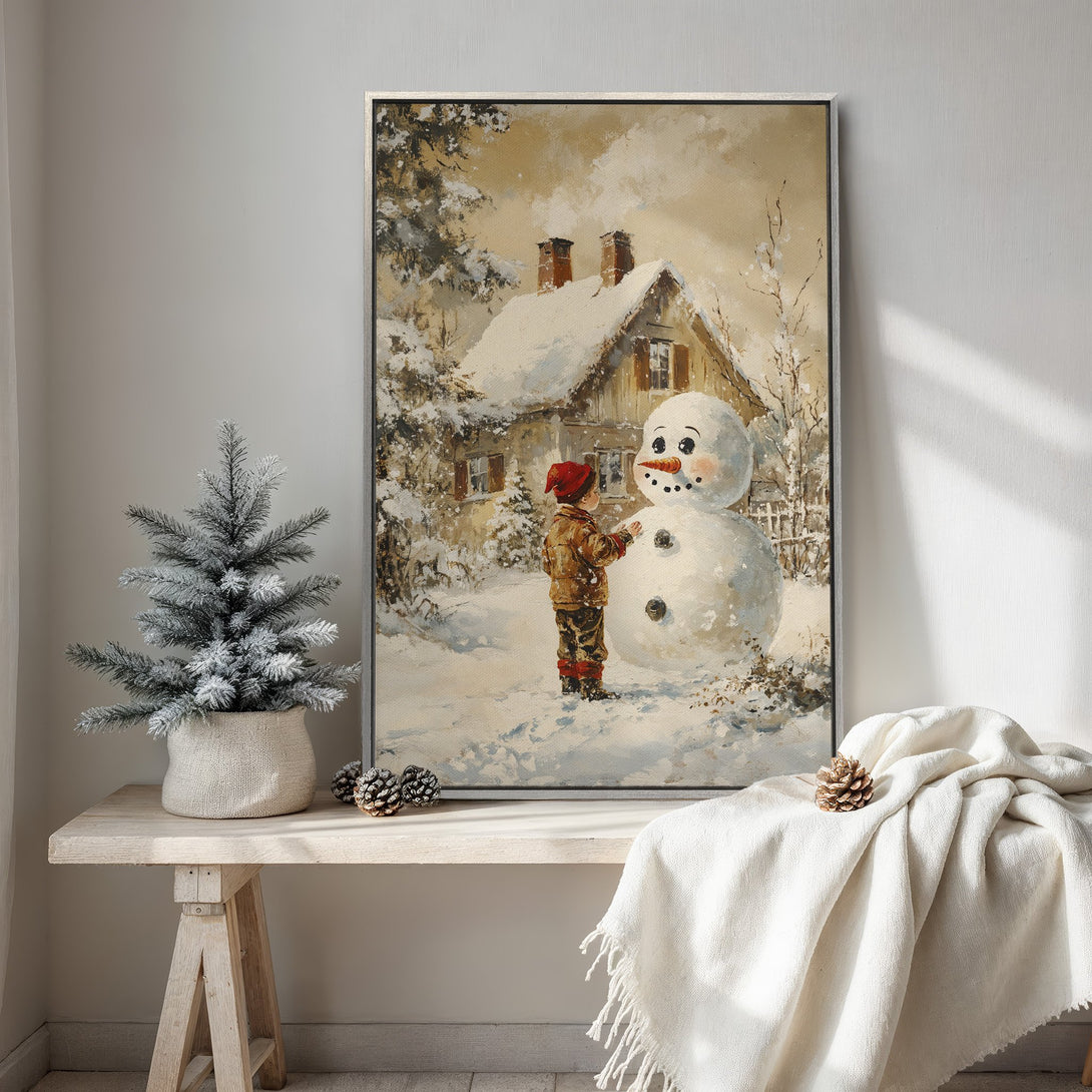 Framed Wall Art: Charming winter scene Canvas Print featuring a child building a snowman. Warm, neutral color palette evokes cozy, vintage vibes. Perfect for holiday decor!