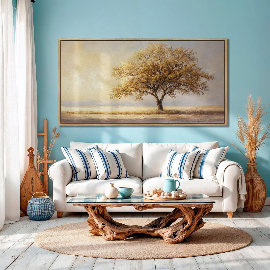 Framed Wall Art featuring a serene tree landscape in warm gold tones. Adds a touch of nature and elegance to any living room.