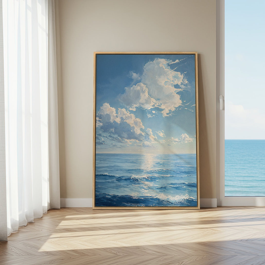 Framed Wall Art of ocean scene in blue and white, displayed in a bright interior. Coastal art for a serene home.