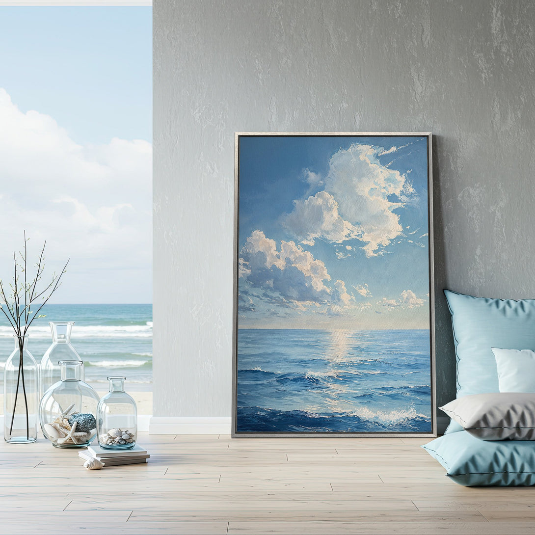 Framed Wall Art featuring a serene ocean scene in a blue and neutral color palette. Coastal-inspired art perfect for any home decor.
