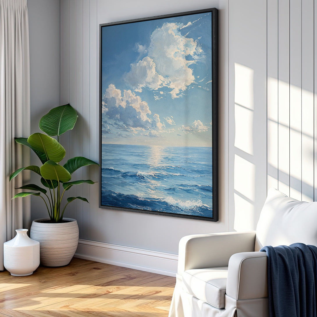 Framed Wall Art: Ocean landscape Canvas Print in blue & white. Coastal art for serene living. Adds a touch of calm to any space.