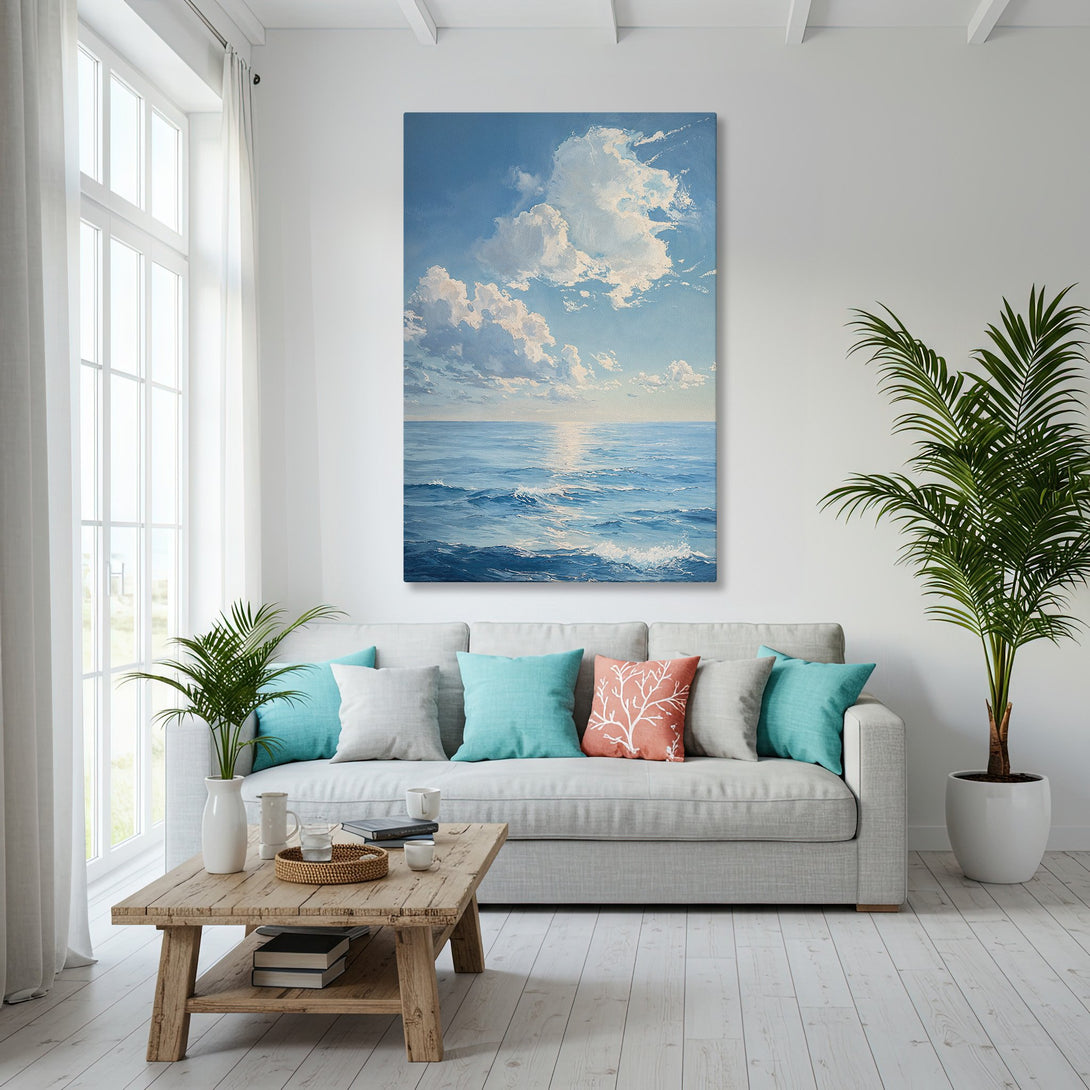 Framed Wall Art: Coastal seascape Canvas Print in blue and white, displayed in a bright, modern living room with ocean view.