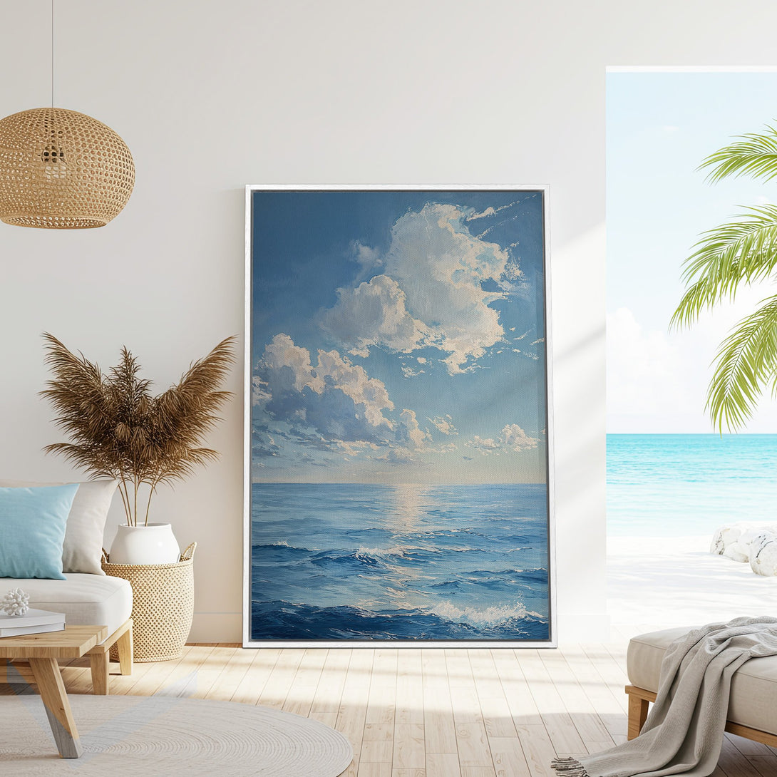 Framed Wall Art: Ocean landscape canvas print in blue and white, displayed in a coastal-style living room. Bring the beach vibes home!