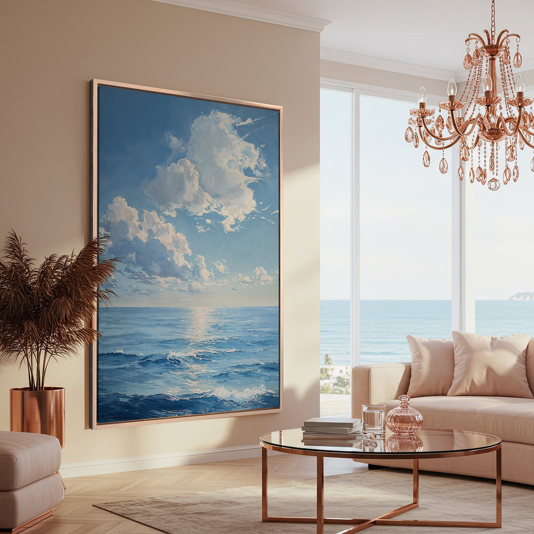 Framed Wall Art: Coastal ocean scene in blue and white tones, displayed in a modern living room. Enhance your space with this serene Canvas Print!