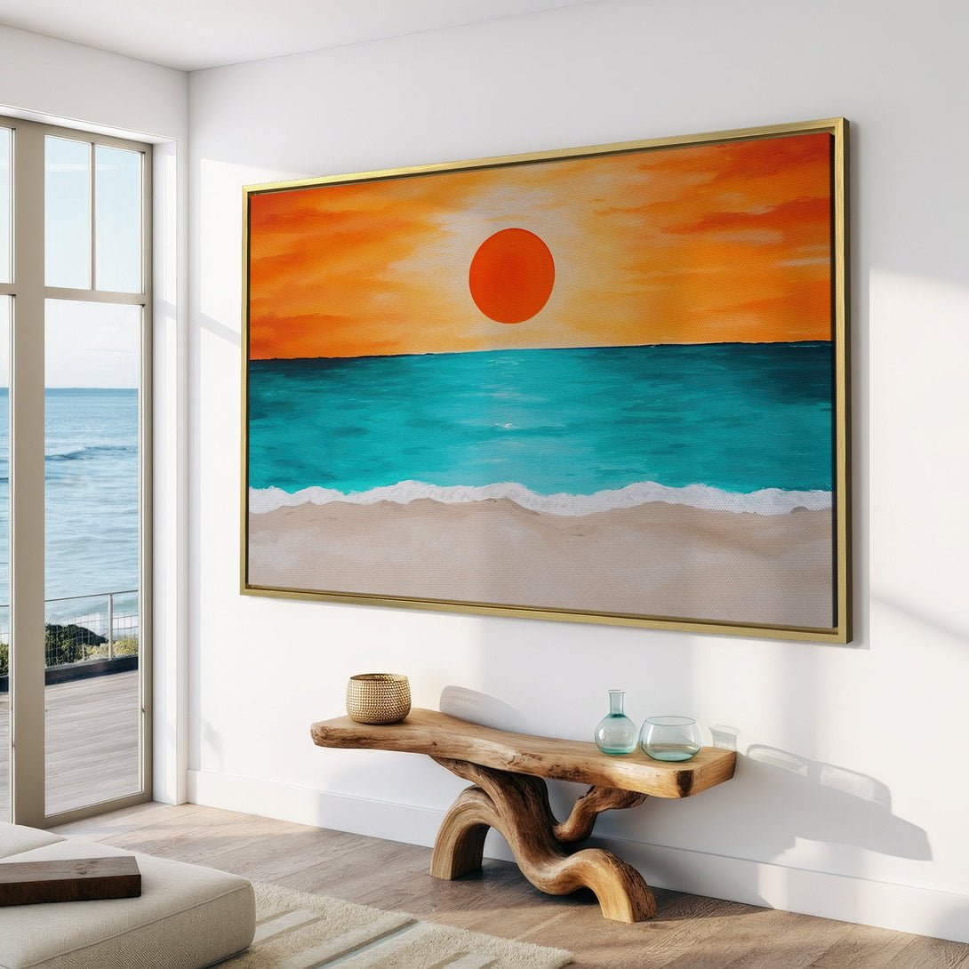 Canvas Print of a sunset over the ocean, displayed in a modern interior. Features warm orange, blue, and beige tones for a calming coastal vibe.
