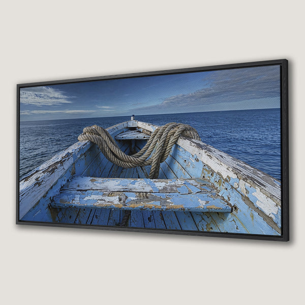Framed Wall Art: Rustic boat on the sea. Coastal decor in blue and neutral tones. Perfect for a serene, nautical-themed home.