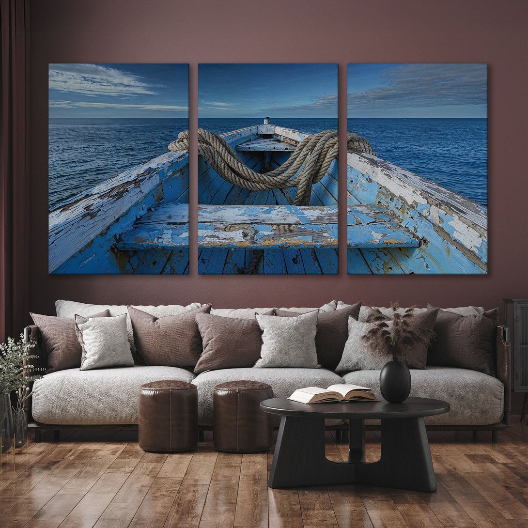Canvas Print of a weathered blue boat on the sea. Coastal style wall art with a blue and neutral color palette, perfect for adding a touch of serenity.