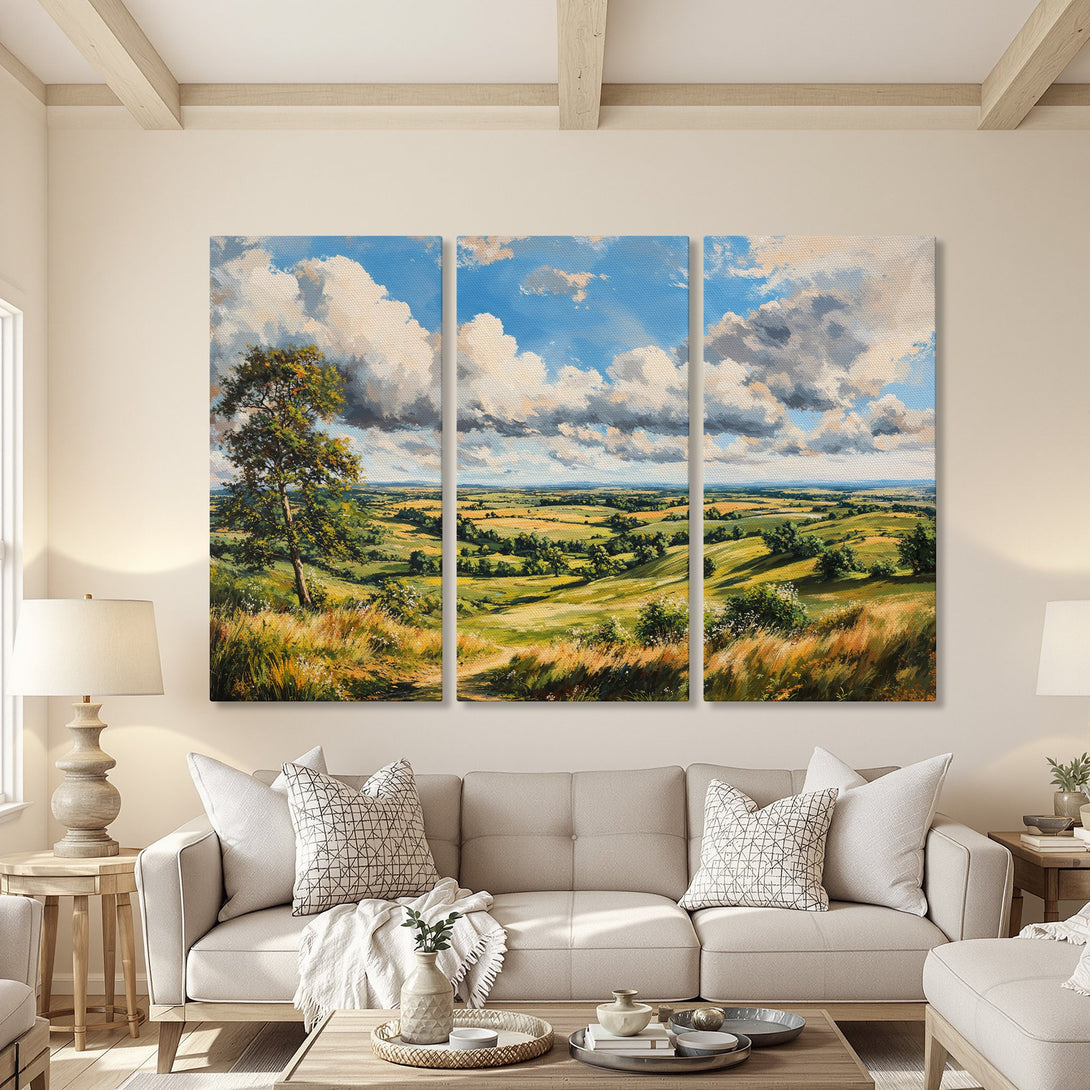 Canvas Print of a serene landscape painting with blue skies, green fields, and a warm color palette, displayed in a cozy living room.