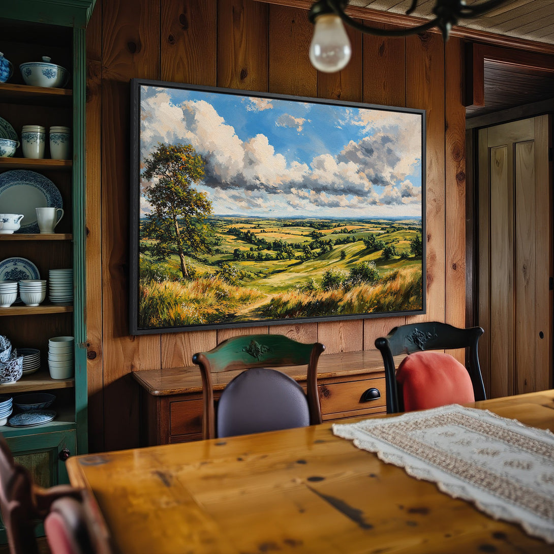 Framed Wall Art: Landscape painting in a rustic interior, featuring a vibrant blue sky and green fields. Perfect for adding a touch of nature to your home.
