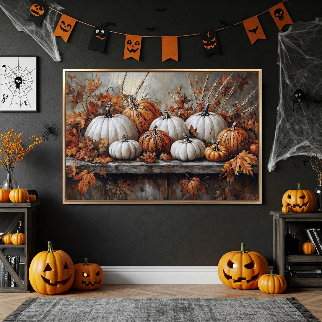 Framed Wall Art featuring pumpkins and autumn leaves, perfect for Halloween decor. Warm orange, brown, and white color palette, adding seasonal charm to any interior.