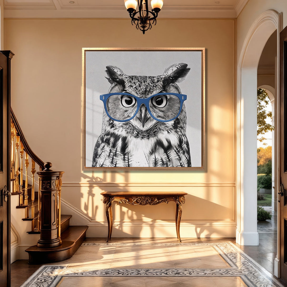 Framed Wall Art: Playful owl portrait with blue glasses, displayed in a classic hallway. Black & white with pops of blue, adding a touch of whimsy.