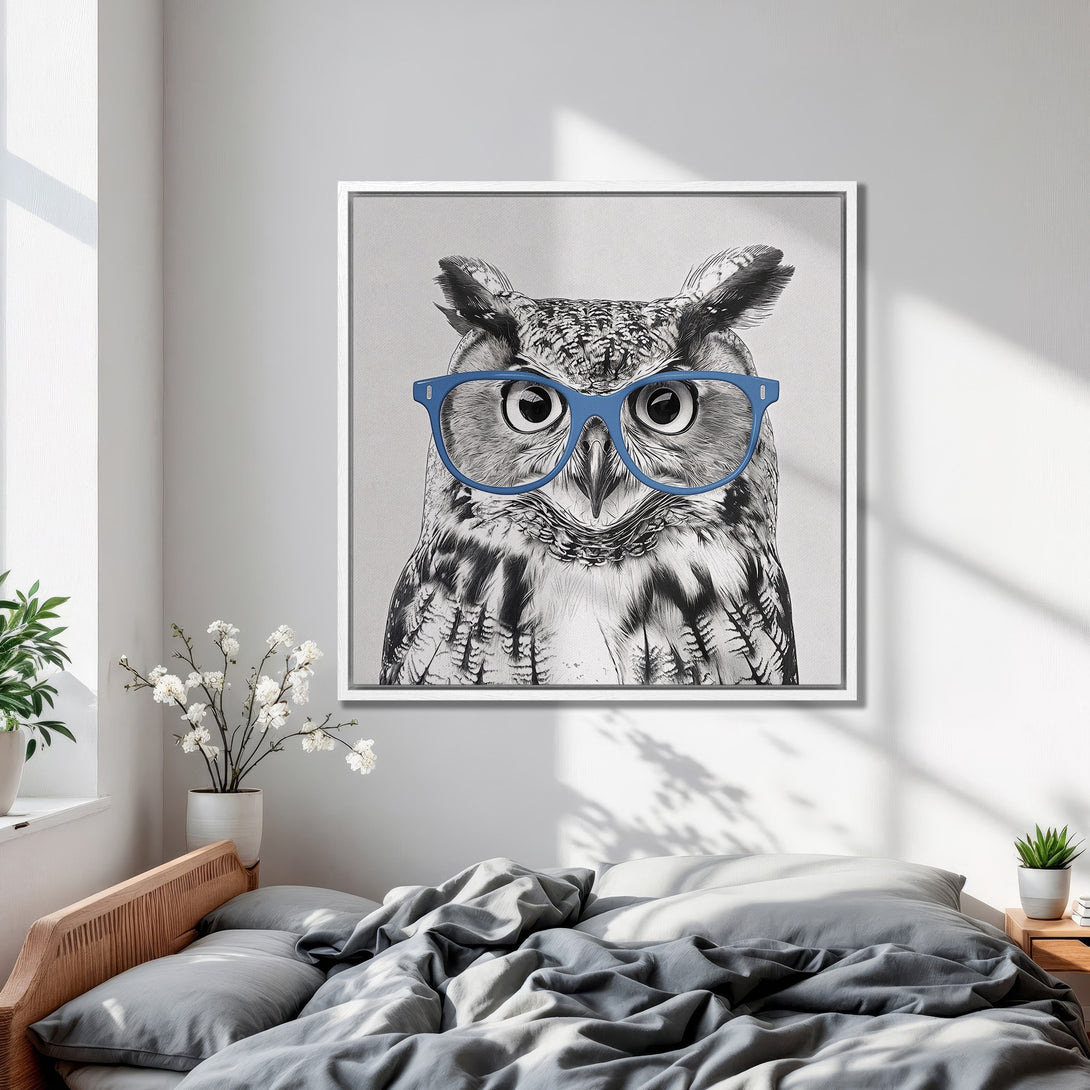 Framed Wall Art: Playful owl portrait with blue glasses in a modern bedroom. Black and white art with a pop of color, perfect for stylish decor.